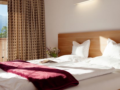 Familienhotel - Wellnessbereich - Tirol - Zimmer mit Doppelbett - Der Stern - Das nachhaltige Familienhotel seit 1509