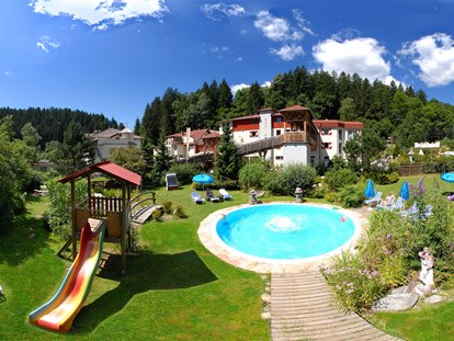 Familienhotel - Pools: Infinity Pool - Kärnten - Smileys Freibad - Smileys Kinderhotel 