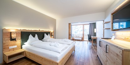Familienhotel - Umgebungsschwerpunkt: Therme - Kärnten - Gutshof Juniorsuite - Hotel GUT Trattlerhof & Chalets****