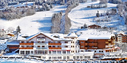 Familienhotel - Tennis - Salzburg - Der Winter im Zinnkrügl - top Lage direkt gegenüber der Bergbahnen im Snow Space Salzburg - Sportwelt Amadé - Hotel Zinnkrügl, Wellness-Gourmet & Relax Hotel