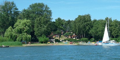 Familienhotel - Garten - Mecklenburg-Vorpommern - Ferienhäuser mit Blick auf den Plauer See - Ferienpark Heidenholz
