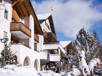 Familienhotel - Wellnessbereich - Schweiz - Winterliche Aussenansicht Aparthotel Muchetta - Davos Wiesen - Graubünden - Schweiz - Aparthotel Muchetta