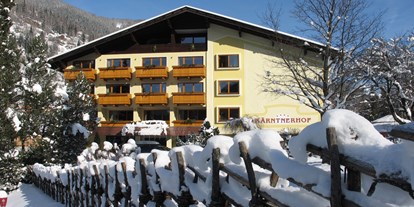 Familienhotel - Kinderwagenverleih - Döbriach - Winteransicht KAHO - Familien- & Sporthotel Kärntnerhof