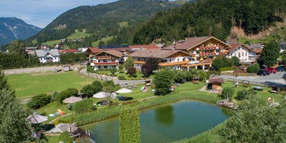 Familienhotel - Kinderbecken - Zell am See - Furtherwirt mit Bio-Badeteich - Familotel Landgut Furtherwirt