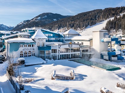 Familienhotel - Skilift - Österreich - Umgeben von den Skipisten mitten im Herz der schönen Flachau - Sie sind bei uns direkt am Puls der Zeit! - Schlosshotel Lacknerhof****S Flachau