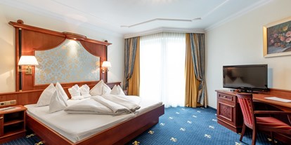 Familienhotel - Spielplatz - Unken - Schlafzimmer in der Luxus-Suite Familienresidenz - Hotel Seehof