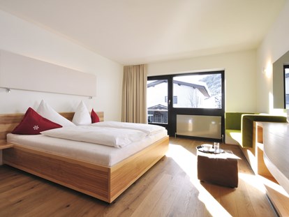 Familienhotel - Wellnessbereich - Klosters - Familienfreundliche Zimmer mit höchstem Schlafkomfort.  - Familienhotel Mateera im Montafon