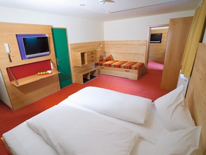 Familienhotel - Umgebungsschwerpunkt: Stadt - Klosters - Familienzimmer mit Schlafkomfort.  - Familienhotel Lagant