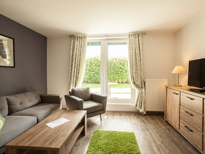 Familienhotel - Umgebungsschwerpunkt: am Land - Deutschland - Wohnbereich im Appartement - Frieslandstern - Ferienhof und Hotel