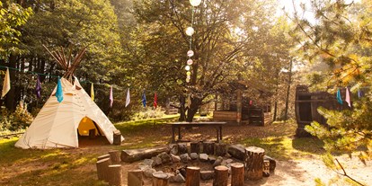 Familienhotel - Sauna - Vorpommern - Indianer Claim mit Stockbrotbacken, Bogenschießen und Goldwaschen - Familotel Borchard's Rookhus