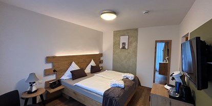 Familienhotel - Umgebungsschwerpunkt: Berg - Schwarzwald - Doppelzimmer Waschbär - Single mit Kind - Genuss- & Familienhotel Bären am See