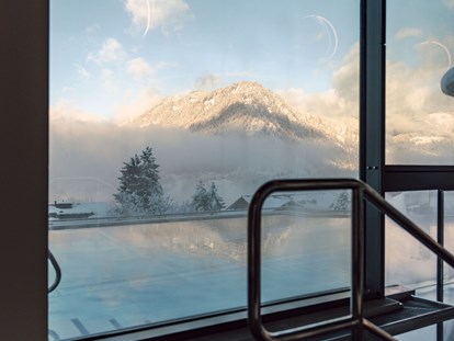 Familienhotel - Garten - Winter im Alpina Alpendorf  - Alpina Alpendorf