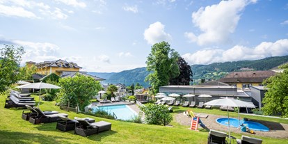 Familienhotel - Schwimmkurse im Hotel - Kärnten - Beheiztes Felsenfreibad - Familienhotel Post am Millstätter See - family.sport | see.berg