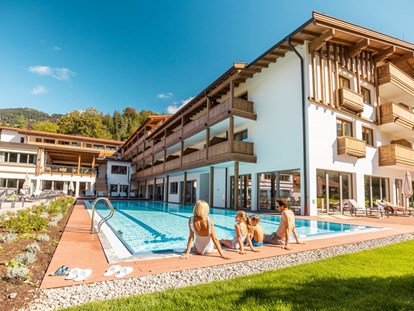Familienhotel - Wasserrutsche - Walchsee - Das Bayrischzell Familotel Oberbayern