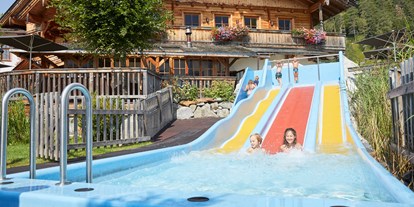 Familienhotel - Schwimmkurse im Hotel - Tiroler Unterland - Wasserrutsche  - Familienparadies Sporthotel Achensee****