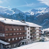 Familienhotel: Der Alpenhof - Außenansicht im Winter. - Hotel Alpenhof