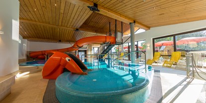Familienhotel - Schwimmkurse im Hotel - Österreich - Hallenbad 32,5°C, Elefantenrutsche und 17 Meter Kinderrutsche - Hotel babymio