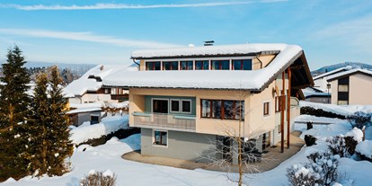Familienhotel - Garten - Egg am Faaker See - Villa Karglhof - im Winter - Ferienwohnungen und Seebungalows am Faaker See - Karglhof OG