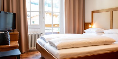 Familienhotel - Garten - Kitzbühel - Elternschlafzimmer Familienappartement - The RESI Apartments "mit Mehrwert"