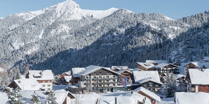 Familienhotel - Kinderwagenverleih - Gorfion Familotel Liechtenstein im Winter, direkt an der Skipiste - Gorfion Familotel Liechtenstein