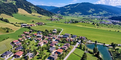 Familienhotel - Ausritte mit Pferden - Salzburg - Vogelperspektive auf unsere Sonnberg Ferienanlage - Sonnberg Ferienanlage