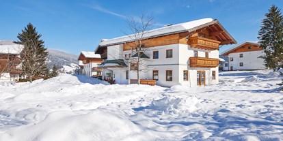 Familienhotel - Ausritte mit Pferden - Salzburg - Sonnberg Ferienanlage im Winter - Sonnberg Ferienanlage