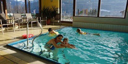 Familienhotel - Kletterwand - Landskron - nawu_apartments_Schwimmschule_Babyschwimmen - nawu apartments
