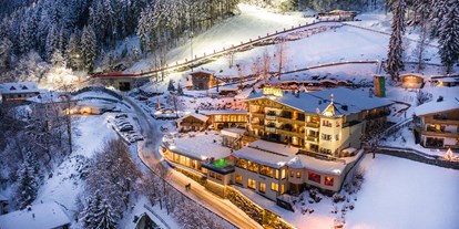 Familienhotel - Garten - Zillertal - Ski in Ski out: urlauben Sie direkt an der Skipiste - Alpin Family Resort Seetal