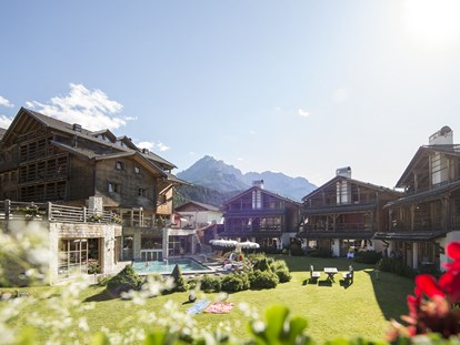 Familienhotel - Kinderbecken - Post Alpina - Family Mountain Chalets