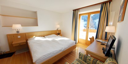 Familienhotel - Verpflegung: Halbpension - Graubünden - Familienzimmer im Aparthotel Muchetta, Davos Wiesen, Schweiz - Aparthotel Muchetta