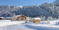 Familienhotel - Ausritte mit Pferden - Tiroler Unterland - Das Schnee - Abenteuerland direkt vor dem Haus - Familotel Landgut Furtherwirt