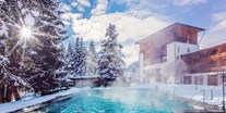 Familienhotel - Skilift - Kärnten - Außenansicht DIE POST im Winter - Hotel DIE POST