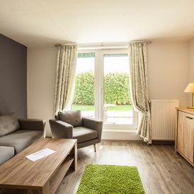 Kinderhotel: Wohnbereich im Appartement - Frieslandstern - Ferienhof und Hotel