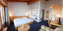 Familienhotel - Verpflegung: Halbpension - Graubünden - Einzimmerappartement Superior im Aparthotel Muchetta, Davos Wiesen, Schweiz - Aparthotel Muchetta