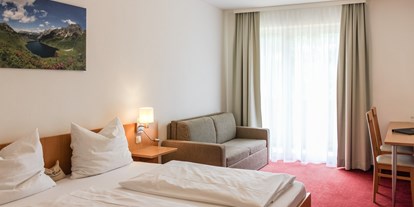 Familienhotel - Pools: Schwimmteich - PLZ 5611 (Österreich) - Doppelzimmer für bis zu 4 Personen  - Familienhotel Botenwirt ***S