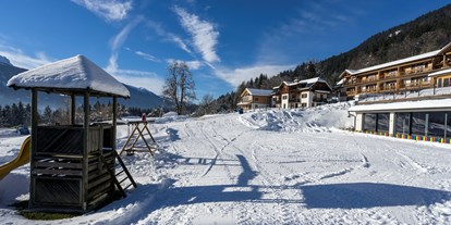 Familienhotel - bewirtschafteter Bauernhof - PLZ 9580 (Österreich) - Winter bei Ramsi - Familienresort & Kinderhotel Ramsi