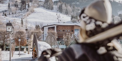 Familienhotel - Kinderbecken - Lofer - Skiurlaub direkt an der Piste - Verwöhnhotel Berghof