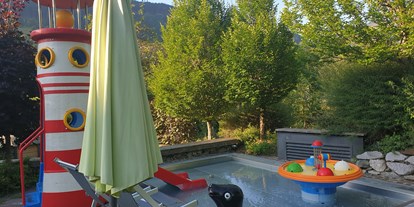 Familienhotel - Kinderwagenverleih - PLZ 6352 (Österreich) - Kleinkinderpool, 35°C, mit Mini-Rutsche und Wasserspielen - Gartenhotel Theresia****S - DAS "Grüne" Familienhotel 