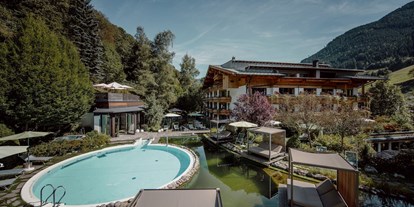 Familienhotel - Sauna - St. Johann in Tirol - Gartenhotel Theresia
Schwimmbecken, Naturschwimmteich, Whirlpool - Gartenhotel Theresia****S - DAS "Grüne" Familienhotel 