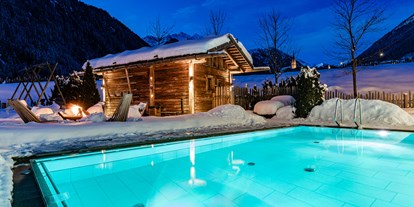 Familienhotel - Babyphone - Trentino-Südtirol - Außenpool Winter - Hotel Masl