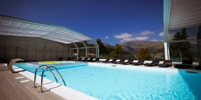 Familienhotel - Pools: Außenpool beheizt - Fai della Paganella - Fabilia Family Hotel Polsa - Trentino Südtirol überdachter Pool - Family Hotel Polsa