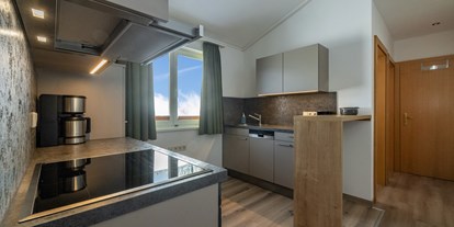 Familienhotel - Sauna - Kärnten - nawu_apartments_Apartment_Jägerhütchen_Waldportier_Küche - nawu apartments