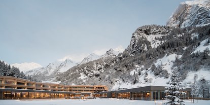 Familienhotel - Einzelzimmer mit Kinderbett - Seefeld in Tirol - Feuerstein im Winter - Feuerstein Nature Family Resort