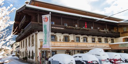 Familienhotel - Verpflegung: alkoholfreie Getränke ganztags inklusive - Oberndorf in Tirol - Mühlpointhof: Winter - Familien und Vitalhotel Mühlpointhof ***S