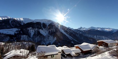 Familienhotel - Babyphone - Klosters - Winteraussicht vom Aparthotel Muchetta - Davos Wiesen - Graubünden - Schweiz - Aparthotel Muchetta