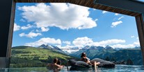 Familienhotel - Bramberg am Wildkogel - Alpenwelt FelsenSPA/ Außen Pool mit Panorama Blick  - MY ALPENWELT Resort****SUPERIOR