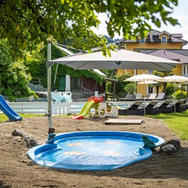 Familienhotel: Beheiztes Kinderbecken - Familienhotel Post am Millstätter See - family.sport | see.berg