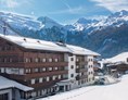 Kinderhotel: Der Alpenhof - Außenansicht im Winter. - Hotel Alpenhof