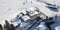 Familienhotel - Kinderbetreuung - St. Johann in Tirol - Winterurlaub direkt an der Piste, 20 m zur Gondelbahn, Pole Position im Skicircus - Wellness-& Familienhotel Egger