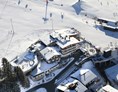Kinderhotel: Winterurlaub direkt an der Piste, 20 m zur Gondelbahn, Pole Position im Skicircus - Wellness-& Familienhotel Egger